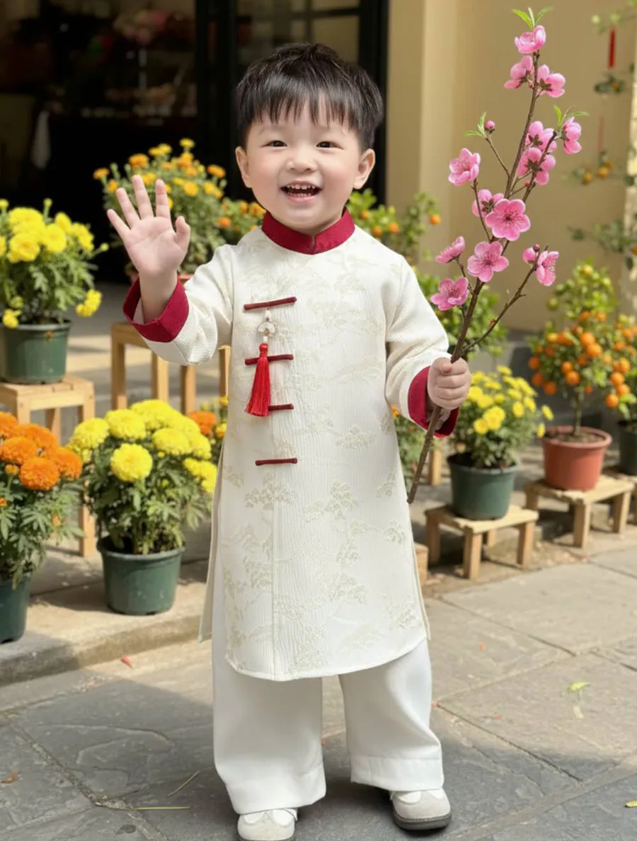 Áo dài bé trai màu be nhã nhặn