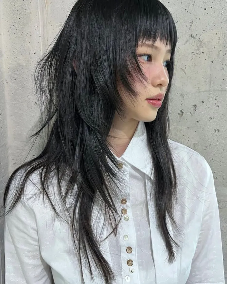 Mullet side part tóc xoăn lơi